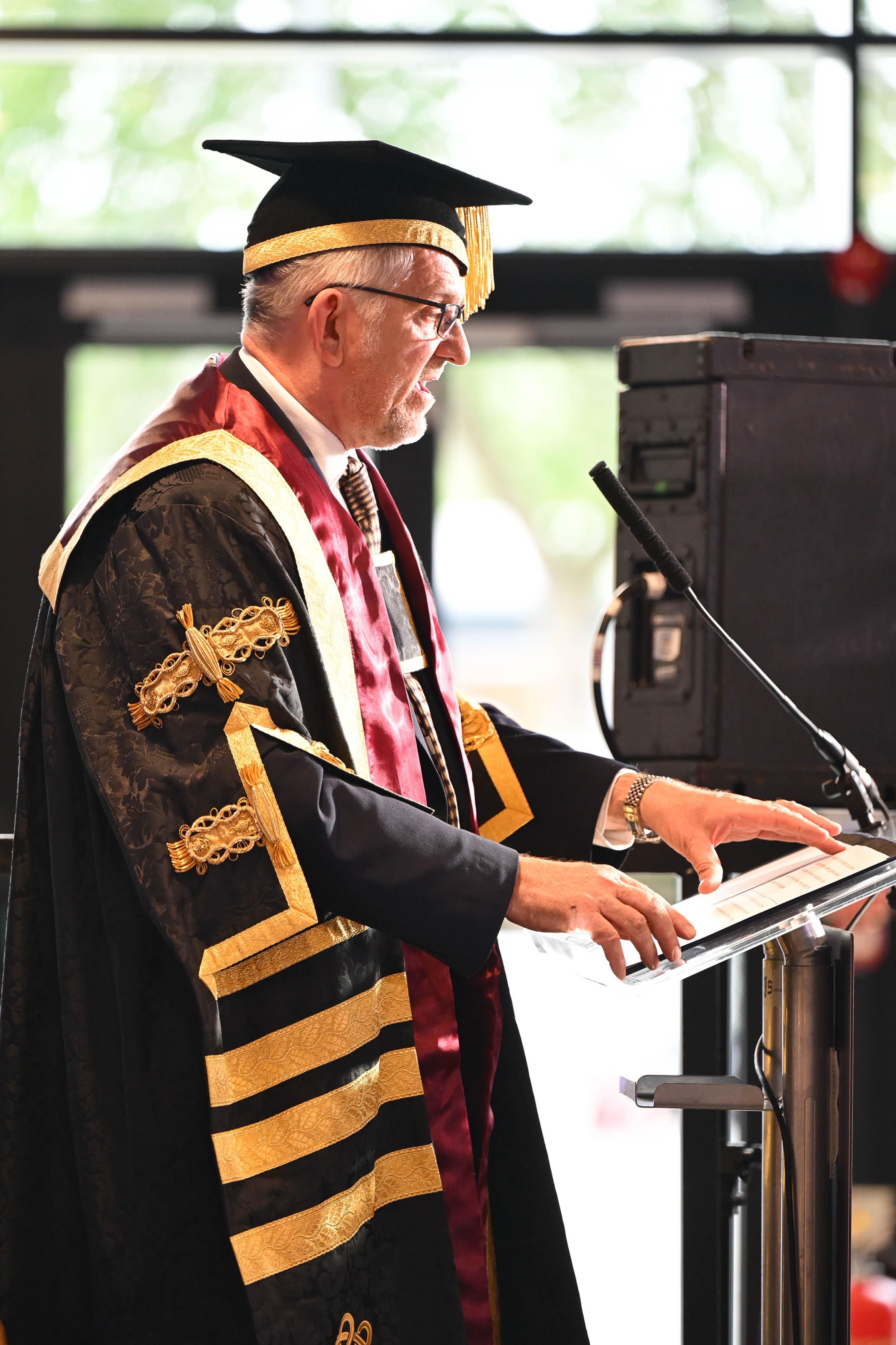 Ceremonial graduation gown officer