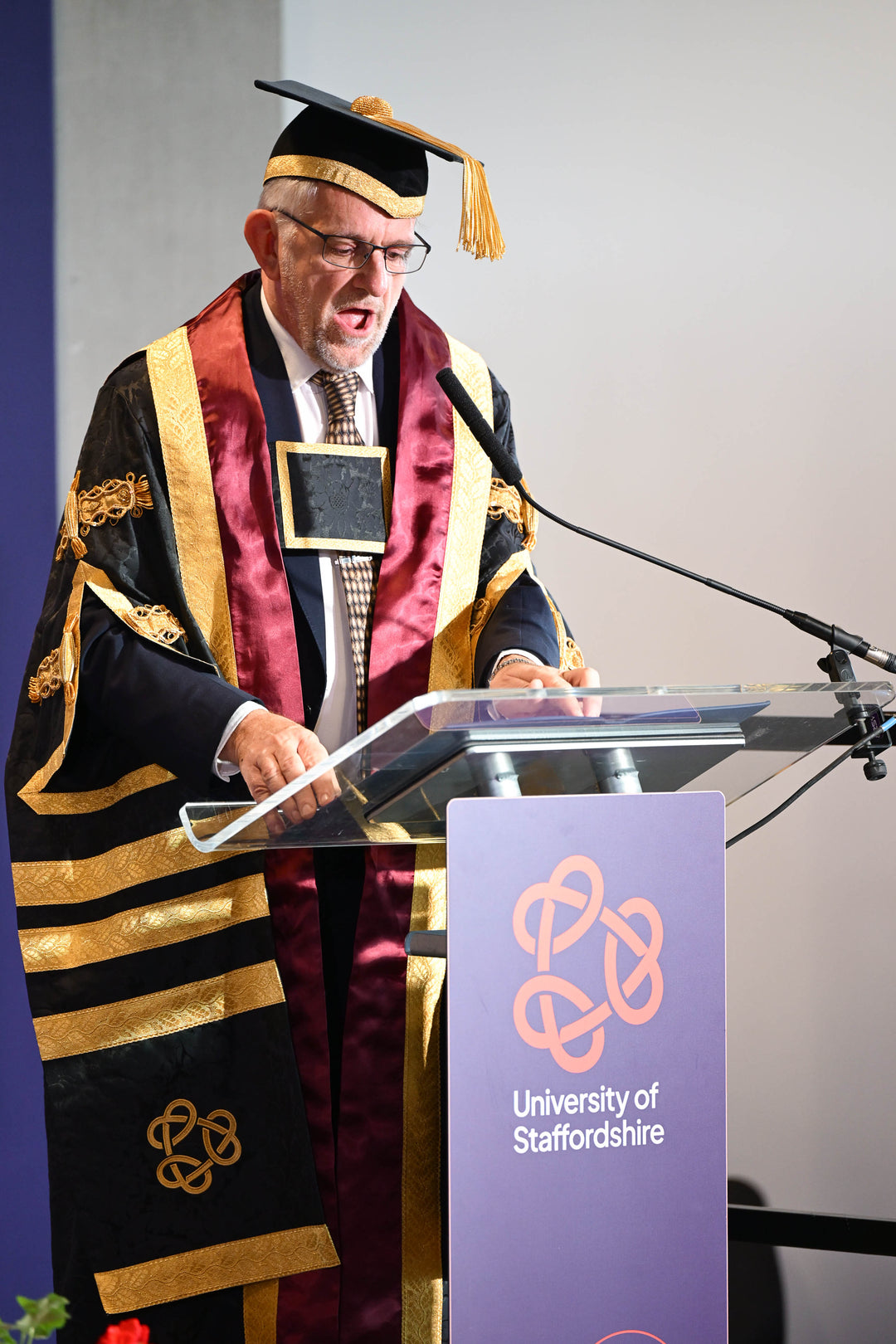 Graduation ceremony officers gown